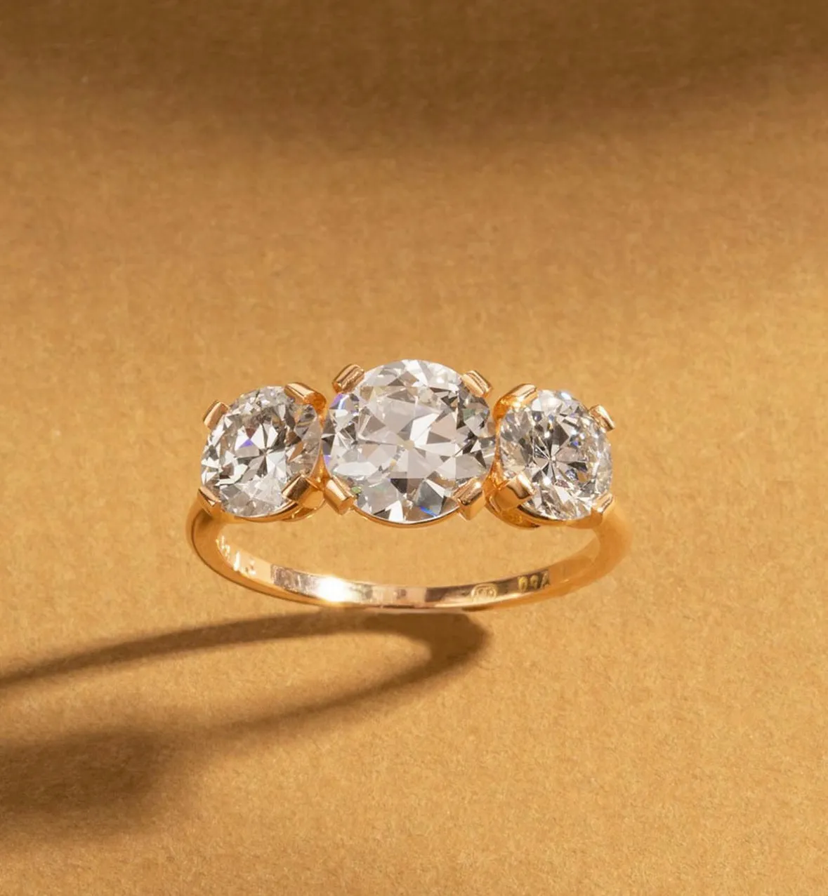 Bell & Bird Tab Prong Three Stone Ring