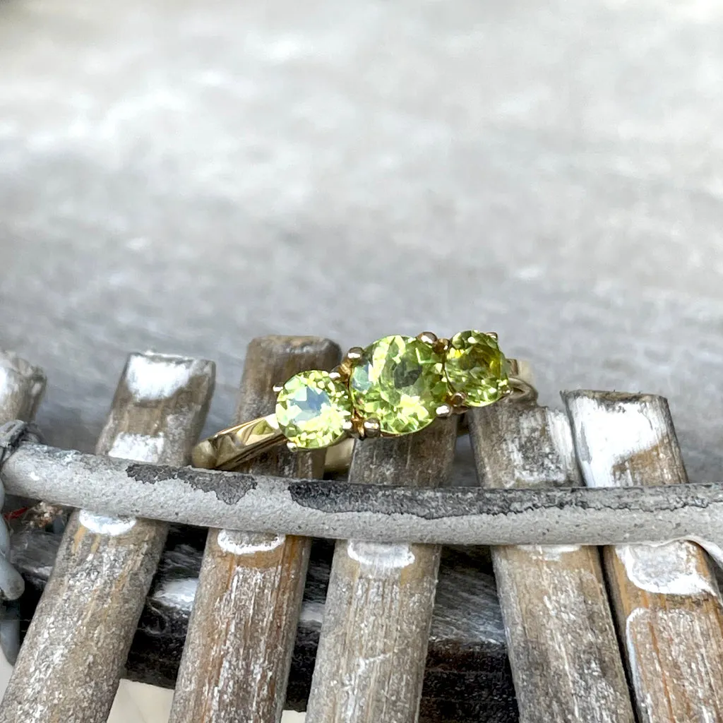Elegant Trilogy Round Cut Peridot Yellow Gold Ring