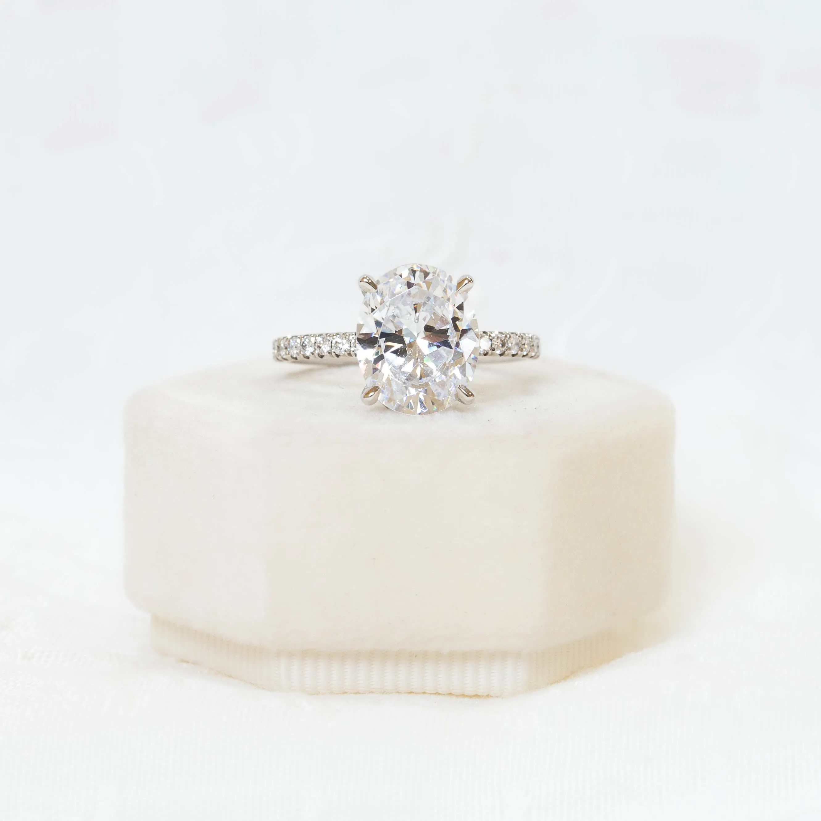 Platinum Oval French-Set Cathedral Diamond Ring